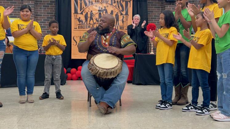 Corey Levier from Holy Ghost Church in Opelousas performed an African Drum song.