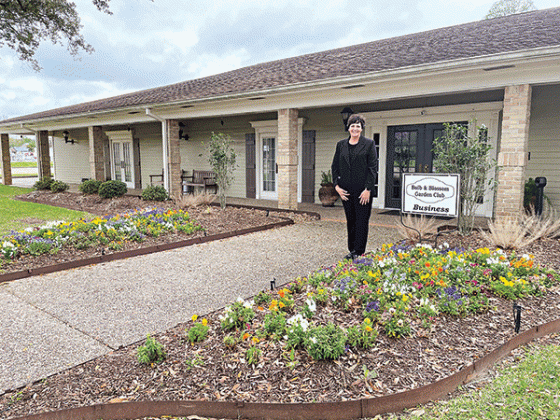 Business Yard of the Month selected by the Bulb & Blossom Garden Club went to Ardoin’s Funeral Home located on West Laurel. Kim LeDoux Fontenot, manager, is pictured. The funeral home features flowering beds  of multi-colored pansies, matuBusiness Yard of the Month selected by the Bulb & Blossom Garden Club went to Ardoin’s Funeral Home located on West Laurel. Kim LeDoux Fontenot, manager, is pictured. The funeral home features flowering beds  of multi-colored pre pink azaleas, and bridal wreath shrubbery. 