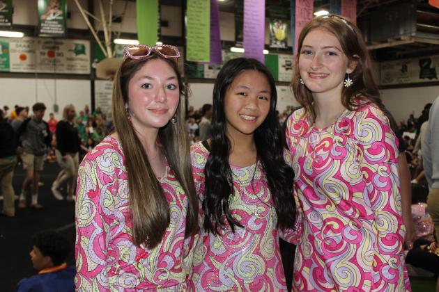 Vivian Fontenot, a freshman; Brooklynn Nguyen, a sophomore; and Destiny Labbe, a junior; dressed as in the past decades for the school’s Renaissance Pep Rally held Friday morning.