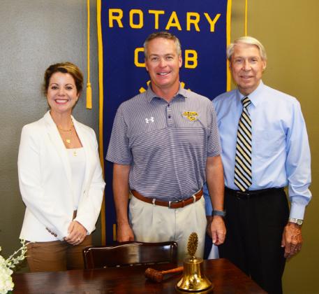 Eunice Rotary Club president Kitty Jo Deshotel joins LSUE head baseball coach Jeff Willis and Donald Mayeux