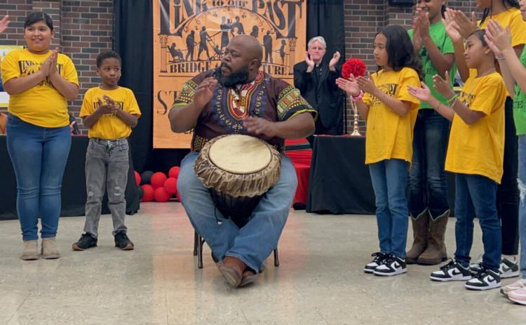 Corey Levier from Holy Ghost Church in Opelousas performed an African Drum song.