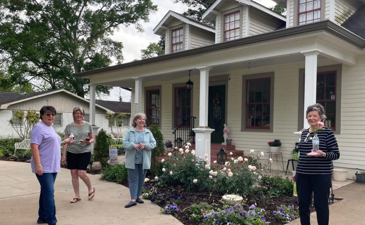 A tour of rose gardens at Kathy Manuel’s home, a member of the Bulb & Blossom Garden Club was part of the members April meeting. From left are Mona Redlich, Jean Johnson, Kathy Manuel, hostess; and Lynn Pavich. (Submitted photo) 