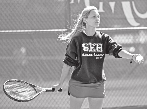 St. Edmund’s Ali Lantz prepares to serve the ball in doubles action. (Photo by Tom Dodge)