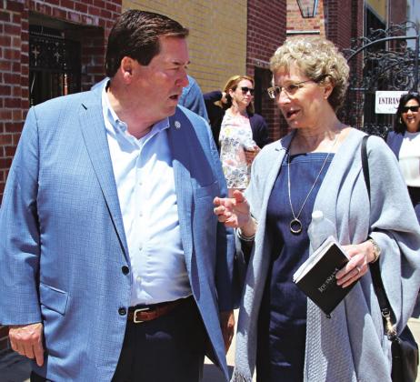 Lt. Gov. Billy Nungesser and Celeste Gomez walk on 2nd Street to the Liberty Theatre on Wednesday. Nungesser said he will help with a restoration project. (Photo by Myra Miller)