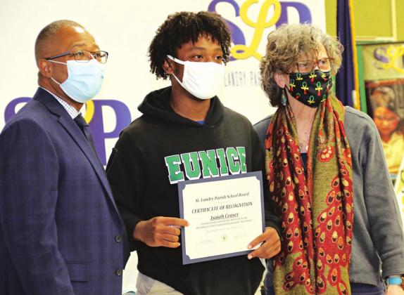 Isaiah Ceaser of Eunice High School was presented a certificate for receiving an honorable mention at the Regional Science Fair. Ceaser and Jase Frank, who was present at the April 1 meeting, were honored for their project in engineering mechanics. With Ceaser are Superintendent Patrick Jenkins, and School Board member Mary Ellen Donatto. (Photo by Harlan Kirgan)