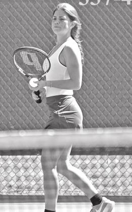 Susannah Summerlin serves the ball. (Photo by Tom Dodge
