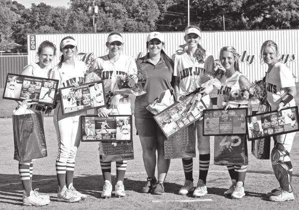 From left, the St. Edmund seniors are Hannah Benoit, Sarah Duplechain, Rebecca Benoit, head coach Lacey LaGrange, Anna Belle Fontenot, Mary Beth Lafleur, Rebecca Benoit and Jacey Cobb. (Photo by Tom Dodge)