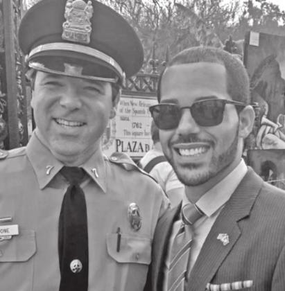 Rep. Matthew Willard, standing with a policeman in New Orleans, is one of the progressives in the Legislature. (Photo courtesy of Rep. Matthew Willard)