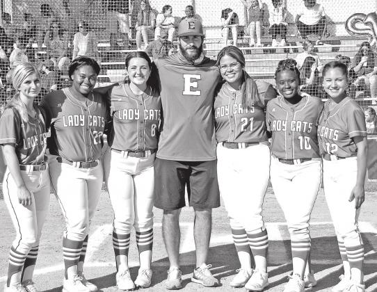 Eunice High softball recognized their seniors before Thursday’s game. From left, are Mallory O’Brien, Trinity Ned, Olivia Thibodeaux, coach Trenon Trosclair, Jailyn Pavich, McKenzie Guillory and Sydni Lemelle. (Photo by Tom Dodge)
