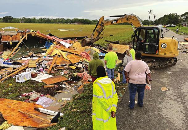 Debris is cleared from the site of a tornado on Saturday near Palmetto that killed one person and left seven injured. (Photo courtesy of St. Landry Parish Government)