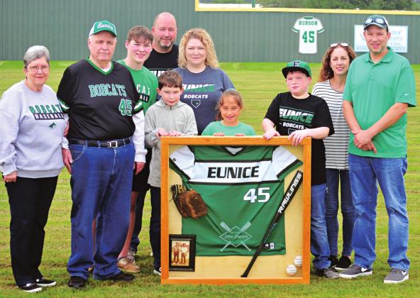 Retired Eunice High School coach John Burson was honored Sunday at Bobcat Field. Burson’s jersey was retired as part of the honors. Front row, from left, Sandifer Burson, John Burson, Cameron Burson, Josie Snorgrass, Cole Burson, Staci Snorgrass and Brian Snorgrass. Second row Caiden Burson and Holli Burson. Back row, Willie Burson. (Photo by Tom Dodge)