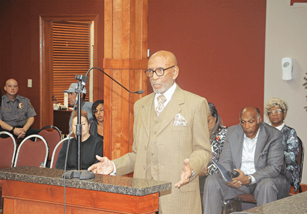 Opelousas attorney Elbert Guillory speaks at the St. Landry Parish Aministrative-Finance Committee meeting on Thursday in Opelousas. Seated, at right, is the Rev. Kerney Thomas, pastor of the Opelousas Life Church. (Photo by Harlan Kirgan)