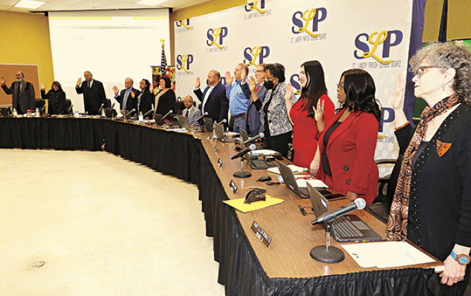 St. Landry Parish School Board members recite their oaths at Thursday’s Board meeting in Opelousas. (Photos by Harlan Kirgan)