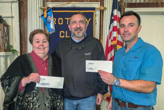 Rotarian Willie Bergeron (governmental services representative for Cleco) made presentations of two donations from Cleco. One was to the Eunice Community Concert Band &amp; Choir. From left, are Pat Dossman, Rotarian and ECCBC co-founder, Bergeron, and Coby Clavier, Rotary President.