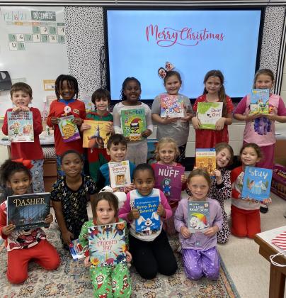 First graders at East receive books