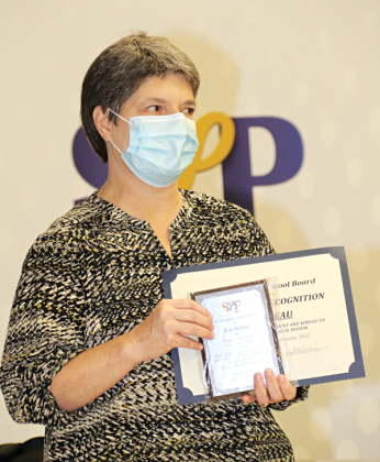 Eunice High School French teacher Lisa Soileau was honored at Thursday’s St. Landry Parish School Board on her retirement after serving more than 32 years. She has been a French teacher for more than 28 years at the high school. (Photo by Harlan Kirgan)