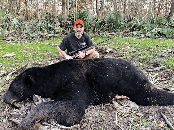 Deron Santiny with the 696-pound Louisiana black bear he harvested in Tensas Parish. (Submitted photo)