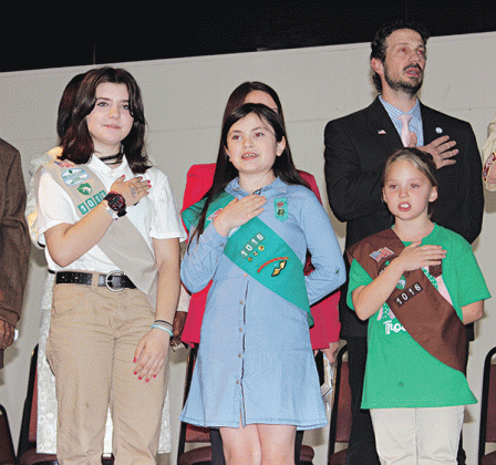 The Girl Scout Troop 1016 led the Pledge of Allegiance during the Inauguration Ceremony program held Thursday. From left, are London (L.J.) Hofstad, Ava Ortego and Kallie Bakka. Alderman Chad Andrepont is in the background.More photos on Page 10. (Photo by Myra Miller)