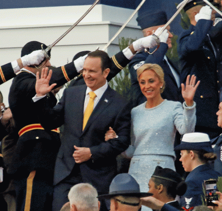 Gov.-elect Jeff Landry and how wife, Sharon, wave as they walk down the capitol steps on Sunday for the inauguration ceremony.(Photo by Harlan Kirgan)