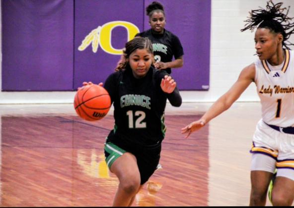 Eunice High Lady Cats Keke Monday plays the ball against the Oakdale Lady Warriors last Friday evening.