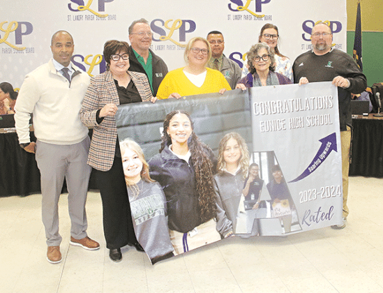 Eunice High School was recognized for earning an A in the annual school accountability grading at Thursday’s St. Landry Parish School Board meeting. From left, are Milton Batiste III, superintendent; Irma Trosclair, principal; Randy Aguillard, ESS teacher; Therese Ginafala, chemistry teacher/ science lead; Dexter Brown  assistant principal; Mary Ellen Donatto, School Board member; Lauren Brown, digital media teacher; and Tre Brown, biology teacher.