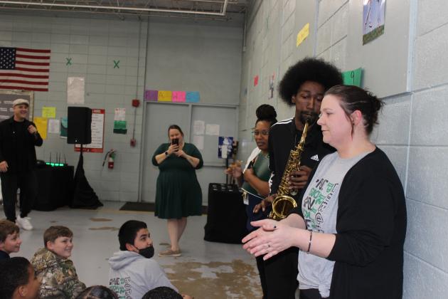Terrance Morgan with TMM Project along with his group of performers and entertainers were on campus Wednesday at Central Middle School. Kenrie Martin of Lafayette plays his saxophone next to sixth grade teacher Brittany Chaddick. (Photos by Myra Miller)