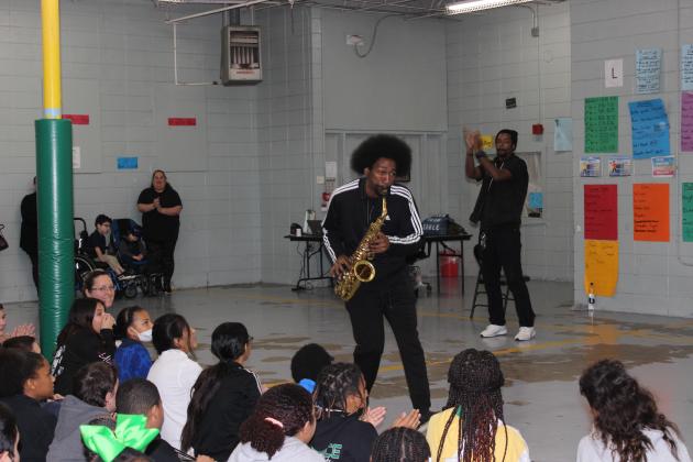 Kenrie Martin of Lafayette, a musician, plays his saxophone