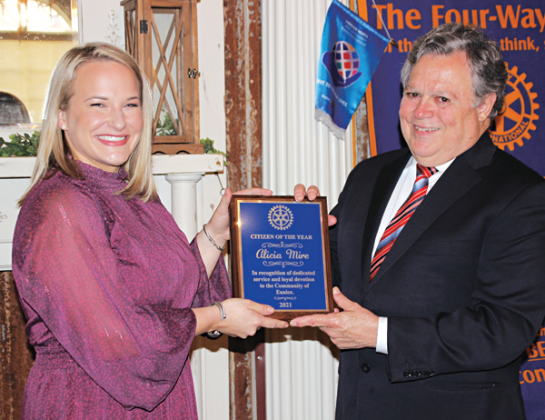 John Pucheu, right, chairman of the Eunice Rotary Citizen of the Year committee, presents Alicia Mire with the Citizen of the Year award at Wednesday’s Eunice Rotary Club meeting, (Photo by Myra Miller)
