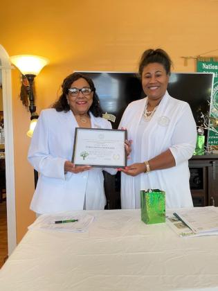 Philomena P. Bernard was presented with a certificate for recognition of one of the original charter members serving 41 years. At right is Shelsy Wiliams, president of the branch.