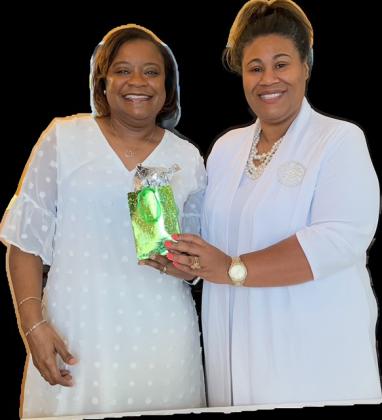 Angela N. Williams was presented a gift bag by President Shelsy Williams in recognition of becoming the newest member of the branch.