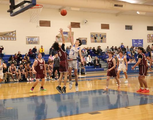 St. Edmund sophomore Jackson Landry shoots the ball against Grand Lake. (Photo by Amy Myers)