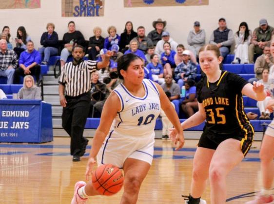 St. Edmund senior Seyda Deshotel takes control of the ball against Grand Lake. (Photo by Rhett Manuel)