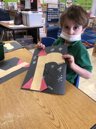 Highland Early Learning Center students are studying a Unit on buildings.  Students are learning how to create, construct, and build many things. Hudson Carron, prek student, shows off his R rocket.