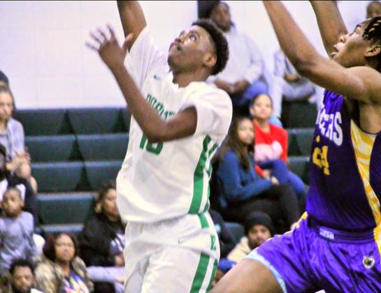 Eunice High freshman Romello Godine knocked down three pointers to help keep Eunice within striking distance against the St. Martinville boys.