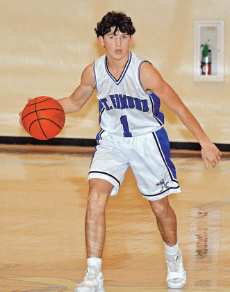 St. Edmund’s Owen Cart brings the ball down the court against Iota. (Photo by Tom Dodge)