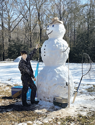 Oscar Summerlin, a junior at St Edmund, built this fishing snowman with a little help from his family and a tractor. His parents are Ben and Laura Summerlin. (Photo by Amy Myers)