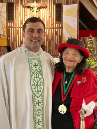 Pictured with the Rev. John Dugas of St. Mathilda Catholic Church, is Catherine G. Thibodeaux, one of the recipients of the MLK Service Awards for the Lafayette Diocese and representing the church.  The other recipient, but not present because of illness at the time of the Mass, was Edward N. Francois, Sr. (Submitted photos)