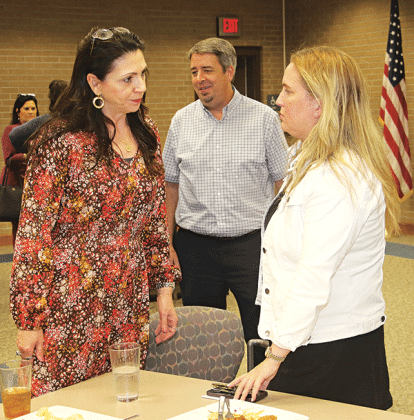 State Rep Julie Emerson, right, talks with St. Landry Parish Assessor Sherri Zeringue McGovern at the Eunice Rotary Club metting on Wednesday. At center is Eunice Mayor Scott Fontenot. Emerson, who heads the House Ways and Means Committee, spoke about tax issues at the meeting held at LSUE. (Photo by Harlan Kirgan)