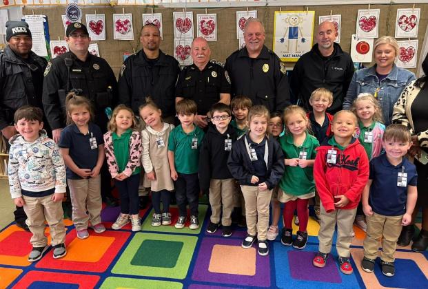 Eunice Police Chief Kyle LeBouef, Deputy Chief Jeremy Ivory, Lieutenant Ryan Young, Sergeant Quintin Doyle, City Marshal Terry Darbonne, Deputy City Marshal Joey Peloquin, and St. Landry Parish School Board member Timmakah Hardy visited Highland Early Learning Center on Jan. 26. They had the opportunity to visit the classrooms and interact with Highland students and staff members. In front, from left, are pre-k students Parker Rodriguez, Hayden Jenkins, Gracie Soileau, Nova Ivey, Alec Huckaby, Maverick Matt