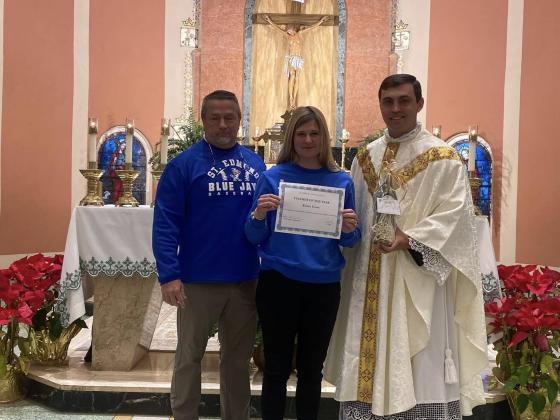 Kristin Evans is St. Edmund’s Middle/High School Teacher of the Year. Evans is pictured with Mitch Fontenot, principal; left, and the Rev. John Dugas.