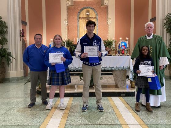 St. Edmund Catholc School names Students of the Year. From left, are Mitch Fontenot, principal; Briley Brown, Middle School Student of the Year; Copeland Miller, High School Student of the Year; and Ava Ardoin, Elementary Student of the Year; and the Rev. Hampton Davis.