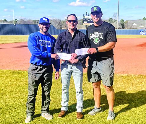 Perry Pitre Ford’s Perry Pitre IV presents a donation check to St. Edmund head baseball coach Casey Charlie and Eunice High head baseball coach Stuart Turner. The two schools put on the annual Perry Pitre Ford Jamboree every year. The two-day event features junior varsity programs on Friday night and varsity programs on Saturday. (Submitted photo)