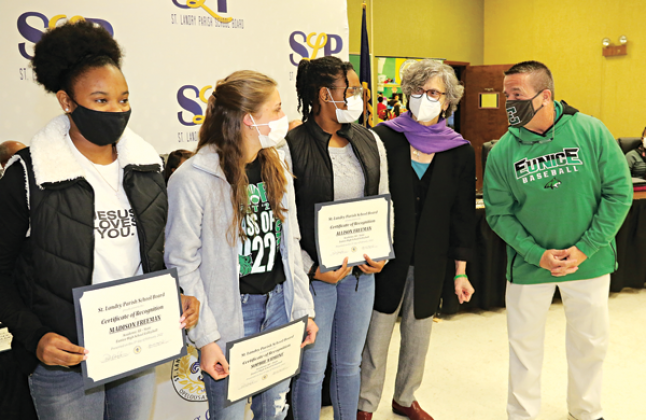 Eunice High All-State Academic volleyball team members were recognized at Thursday’s St. Landry Parish School Board meeting. From left, are Madison Freeman, Sophie Vidrine and Allison Freeman with School Board member Mary Ellen Donatto and Principal Mitch Fontenot. Also honored was Rylea Gradney, not present, for being named to the All-State Academic volleyball and basketball teams. Hayden Darbonne and Dylan Darbonne, also not present were honored for being named to the All-State honorable mention football
