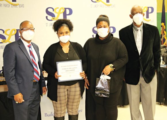 Central Middle School’s Alice Cooper, second from left, was recognized as one of four District Support Employees of the Year at Thursday’s St. Landry Parish School Board meeting. From left, are Superintendent Patrick Jenkins, Cooper, Central Middle School Principal Shelsy Williams, and School Board member and President Albert Hayes Jr.