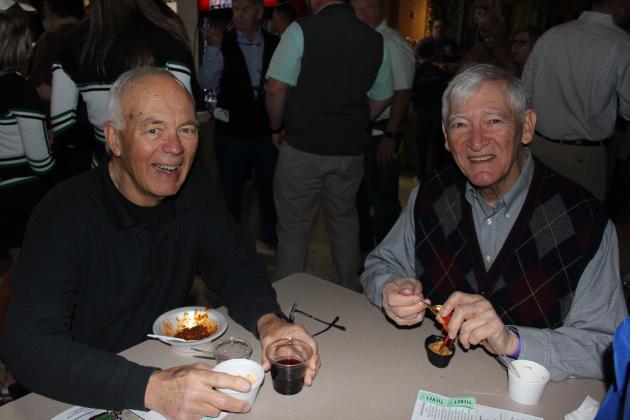Ron Driggs, left, and Kenneth Pitre tried a sampling of alligator chili and Cajun potatoes at the annual Taster’s Choice event held inside the Mumphrey Center at LSUE Wednesday evening.