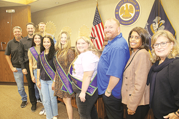 Adding a carnival season look are four Cajun Mardi Gras Festival queens. They were introduced at the Tuesday Eunicy city council meeting and after the meeting lined up for a photo. From left, are Mayor Scott Fontenot, Alderman Chad Andrepont, Teen Cajun Mardi Gras Landri Young, Junior Cajun Mardi Gras; Akashaa Hall,  Deb Cajun Mardi Gras Chloe Fontenot, Junior Cajun Mardi Gras Emma-Kate Reed, Alderman Randall Reed, Alderwoman Germaine Simpson and Alderwoman Connie Thibodeaux. Mardi Gras is scheduled from Fe