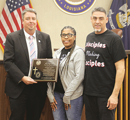 Five community service awards were given at Thursday’s Eunice Board of Aldermen’s meeting. Mayor Scott Fontenot presents an award to Pamela and Caleb Semien of Word Ministries Church. More photos are on Page 5. (Photo by Harlan Kirgan)