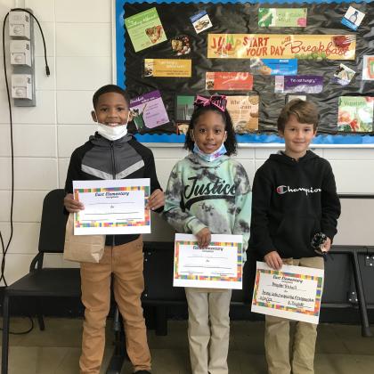 Second graders at East Elementary received awards during a school’s Special Celebration. From left are Joshua Cornely, Harlee Dupre and Brayden Trichell