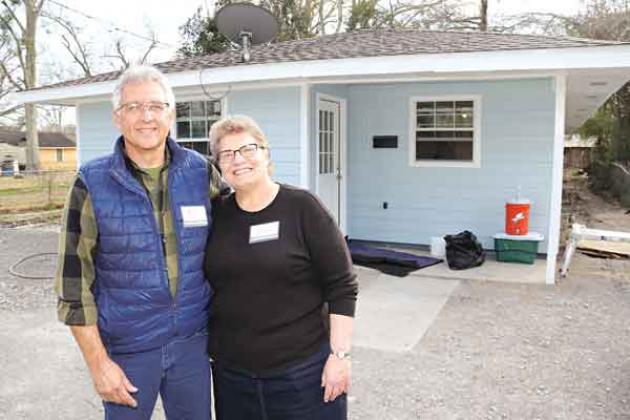 Tim and Barb Slagel of Apostolic Christian Church’s are in front of the house remodeling project on West Green Alley in Church Point on Feb. 15.  The Slagels, of Washington, Illinois, are the ministry coordinators. (Photos by Harlan Kirgan)