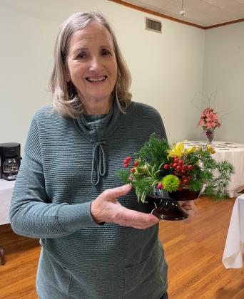 Martha Guempel shows off her finished creation.